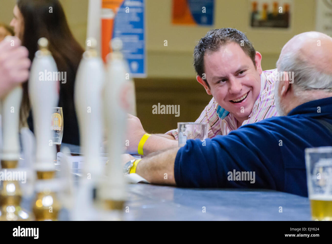 Men enjoying pints of beer at a CAMRA real ale festival. Stock Photo