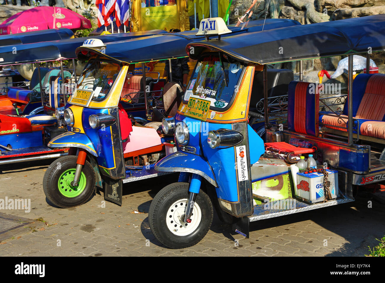 Tuk Tuks parked in the street in Bangkok, Thailand Stock Photo