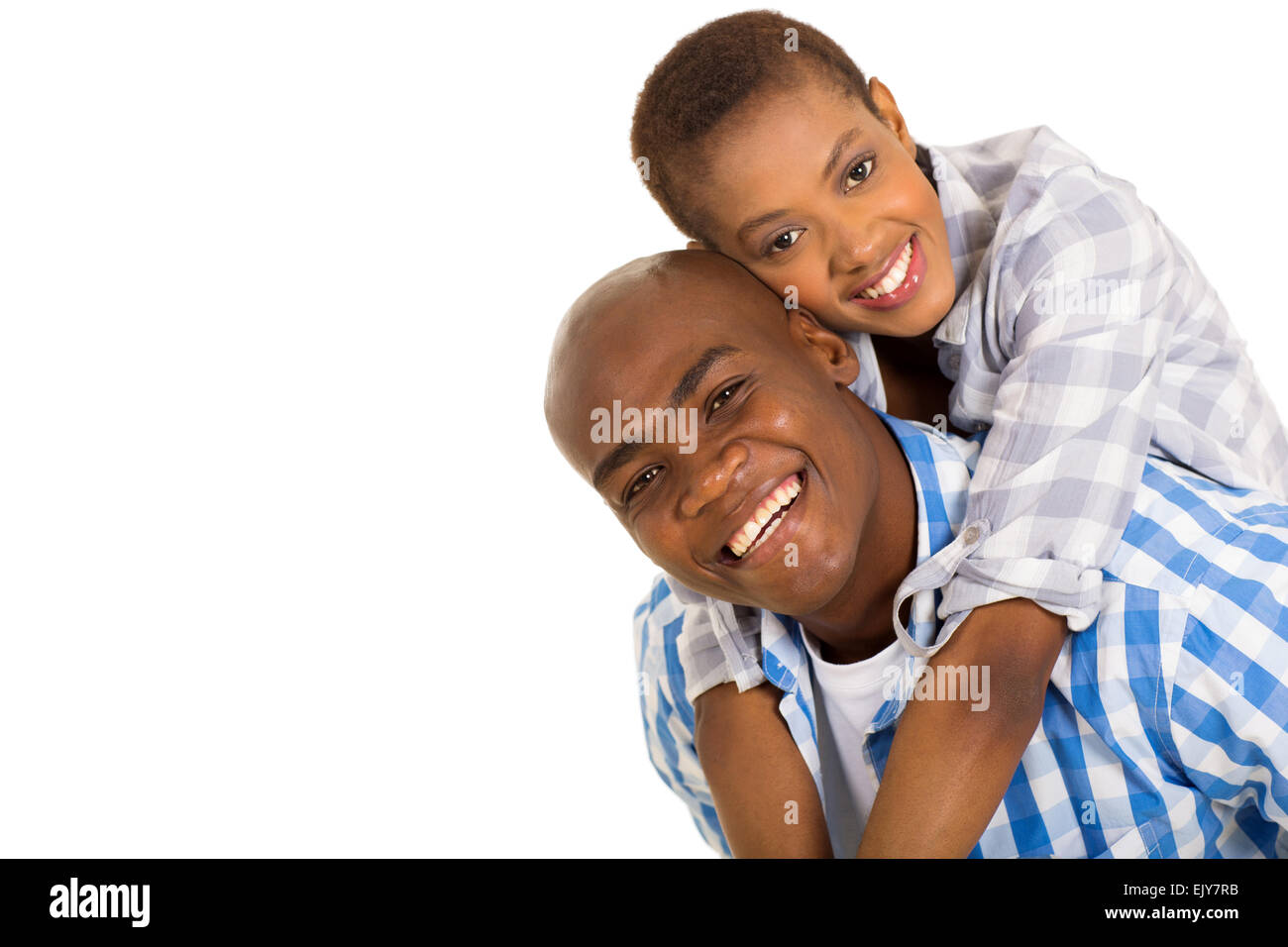cheerful young black couple piggybacking on white Stock Photo