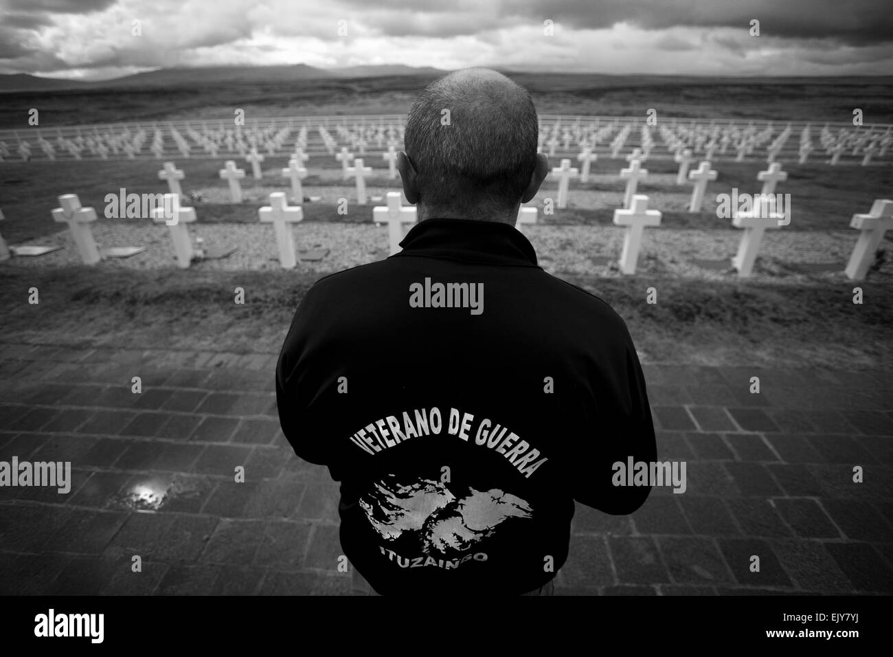 (150402) -- PORT DARWIN, Apr. 2, 2015 (Xinhua) -- Image taken on March 13, 2013, shows Eduardo Miravetto, a veteran of the war in 1982, looking at the tombs of the Argentinean fallen soldiers during his visit at the Darwin Cementery, near Port Darwin, Falkland Islands. Argentine Foreign Minister Hector Timerman on March 30, 2015 wrote to international organizations to denounce Britain for boosting military presence in the Malvinas Islands, known as the Falklands in the European country. Britain and Argentina went to war over the islands in 1982, after Argentina ventured to reclaim the territor Stock Photo