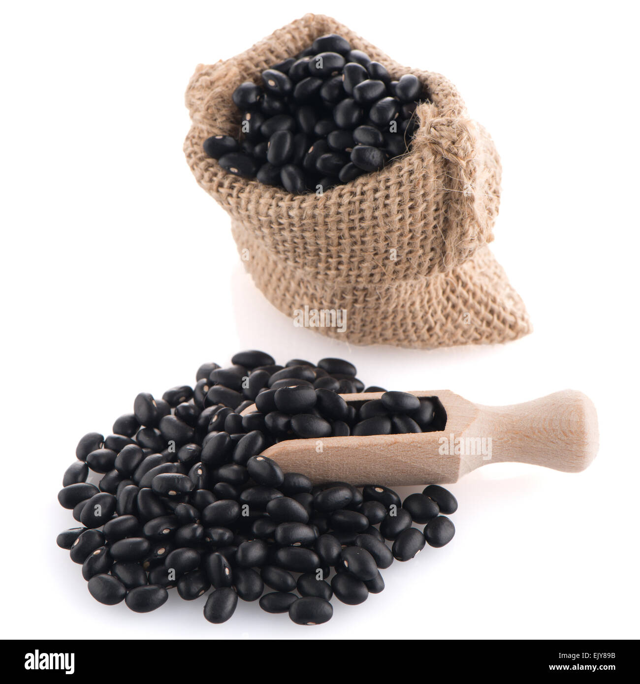 Black beans bag with wooden scoop on white background Stock Photo Alamy
