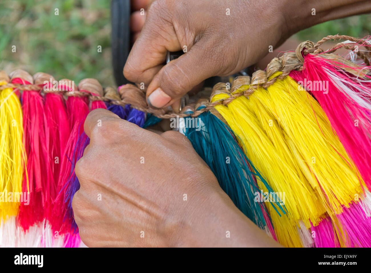 Making grass skirt at Yap Day Festival, Yap Island, Federated States of Micronesia Stock Photo