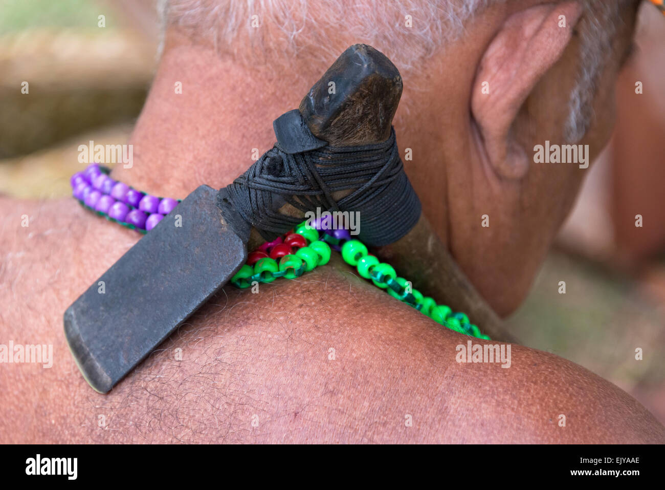 Yapese man carrying carpentry tool, a small ax,  Yap Island, Federated States of Micronesia Stock Photo