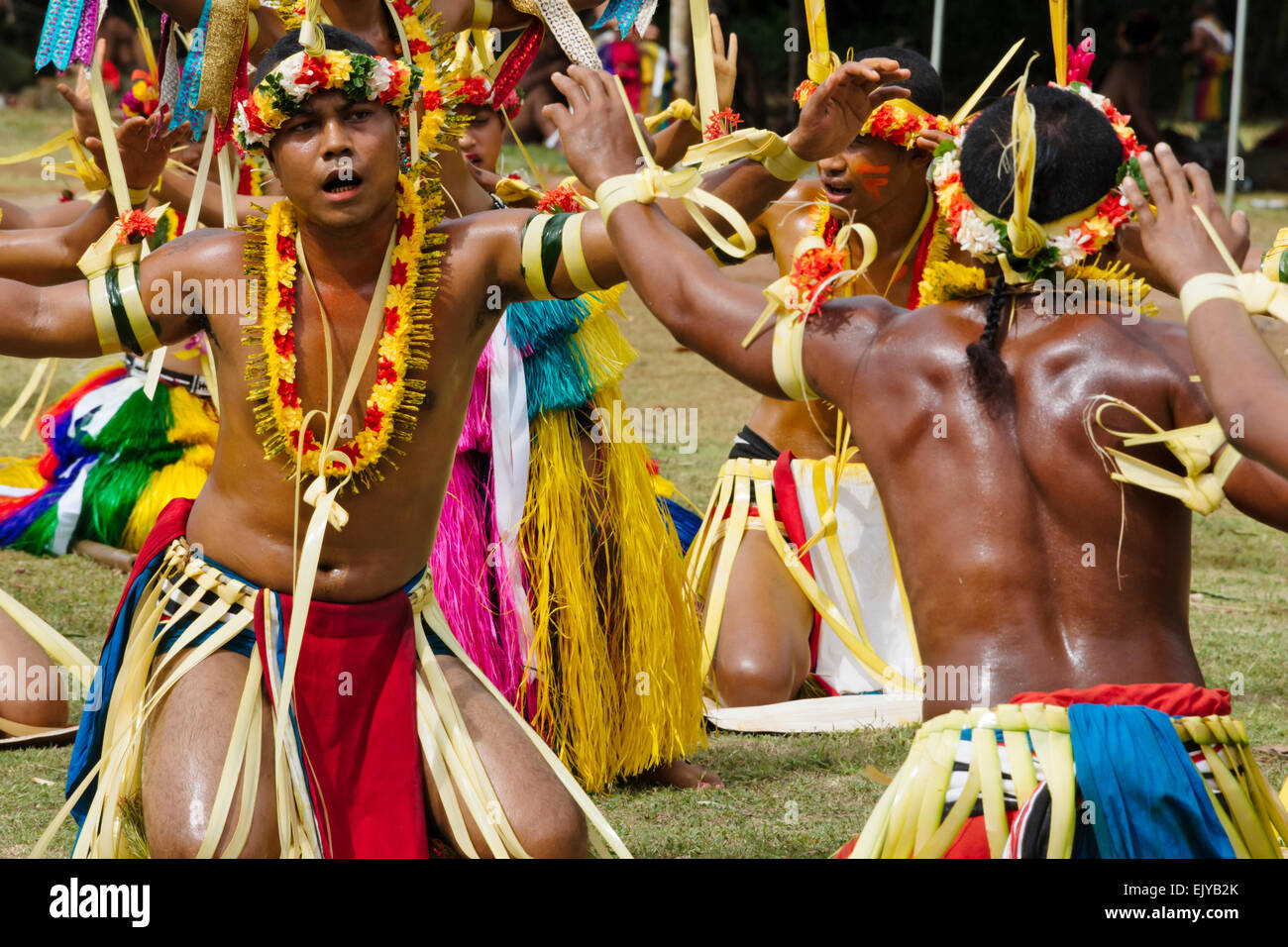 Yapese men in traditional clothing dancing at Yap Day Festival, Yap Island, Federated States of Micronesia Stock Photo