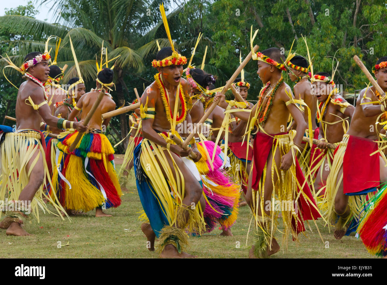 Boys and girls in traditional clothing dancing with bamboo pole at Yap ...