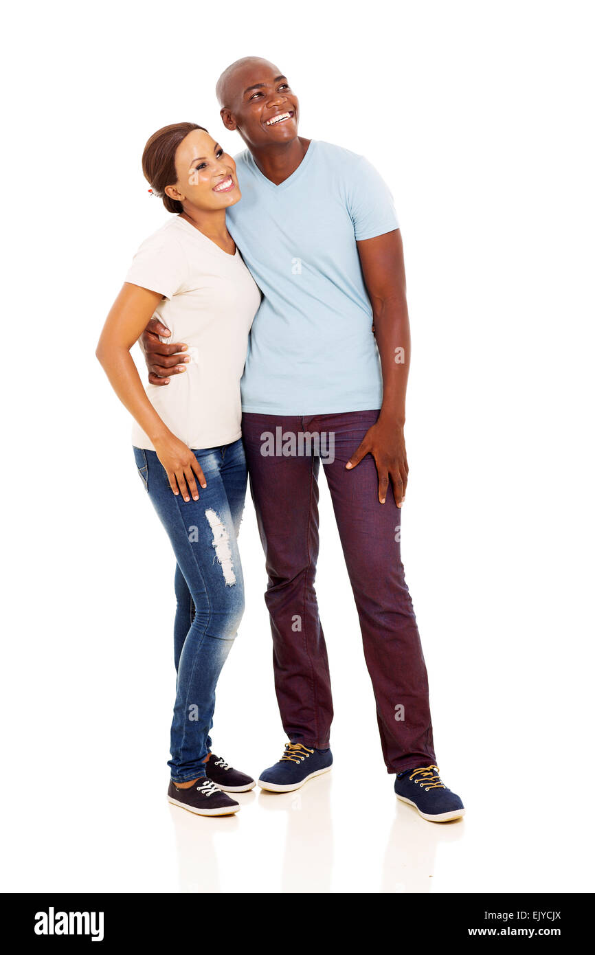 happy young African couple looking up isolated on white background ...