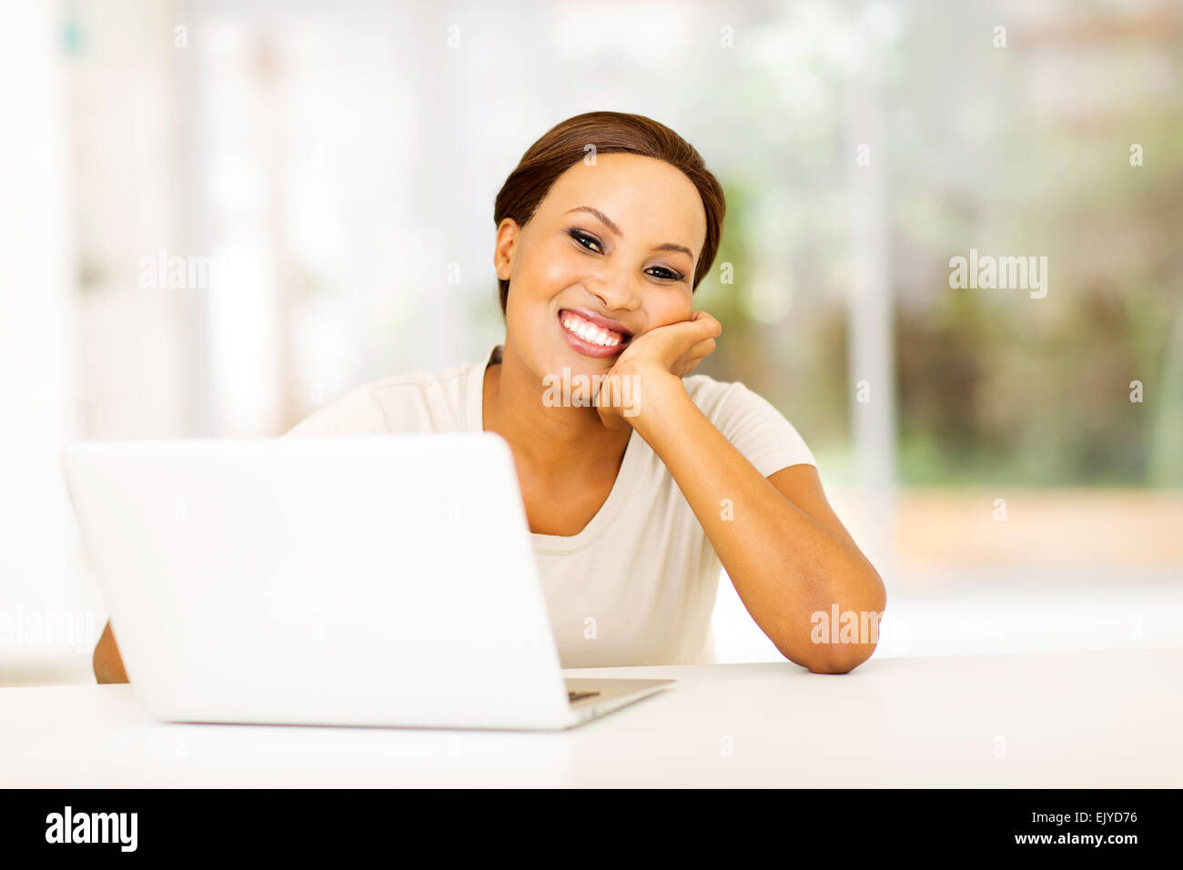 beautiful African American woman relaxing at home with laptop Stock ...