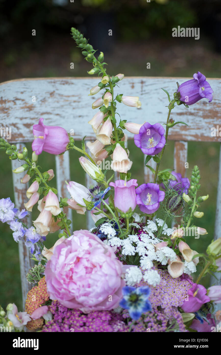 Summer bouquet with achillea (yarrow),  campanula, dahlia, feverfew, foxglove,   Nigella damascena,  , Queen Anne's Lace, snapdragon,   veronica. Stock Photo