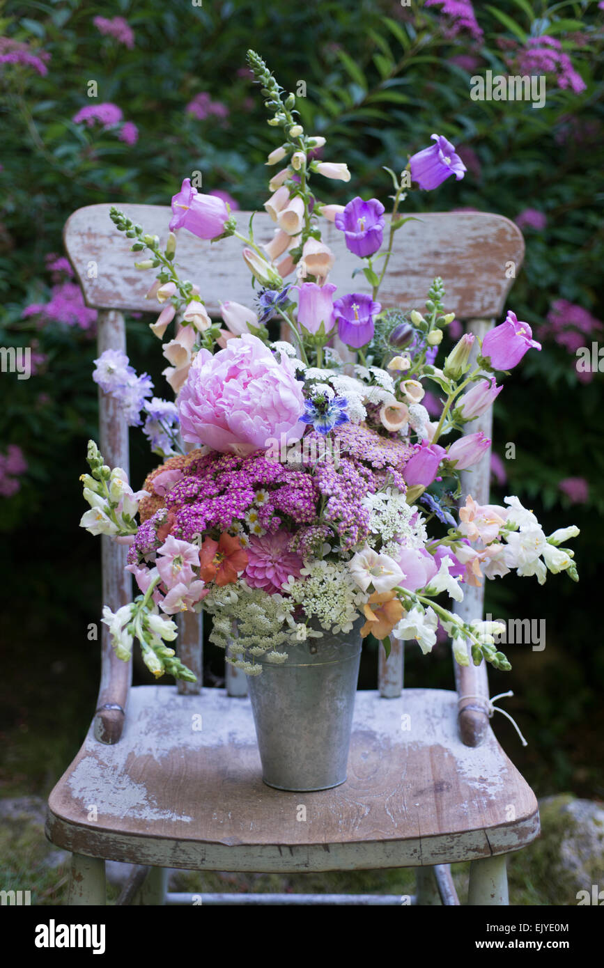 Summer bouquet with achillea (yarrow),  campanula, dahlia, feverfew, foxglove,   Nigella damascena,  , Queen Anne's Lace, snapdragon,   veronica. Stock Photo