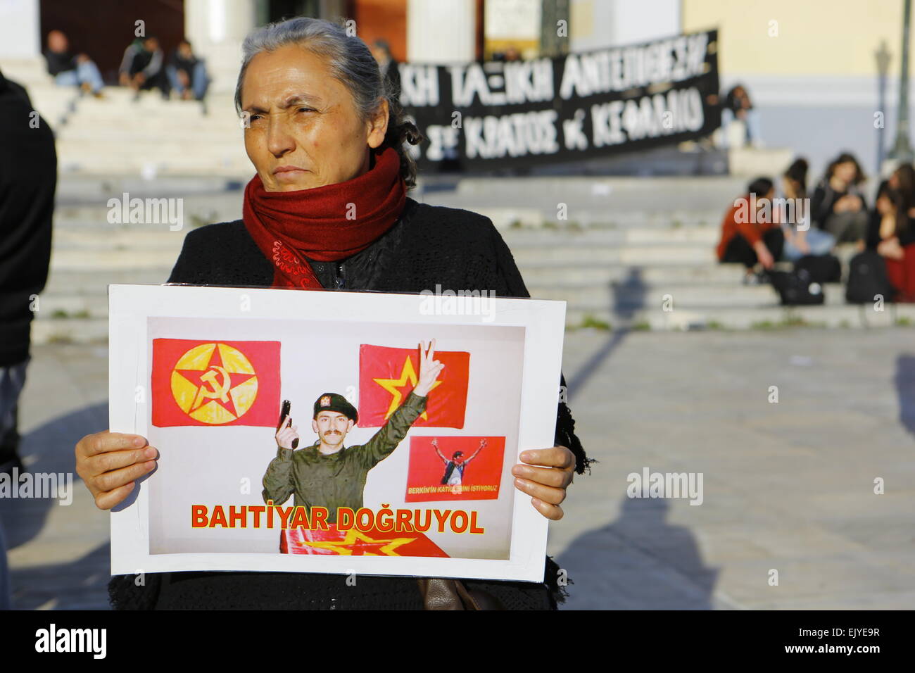 Athens, Greece. 02nd Apr, 2015. A woman holds a picture of one of the hostage takers, Bahtiyar Do?ruyol, with a pistol in his hand. A handful of protesters showed their solidarity with the two killed activists who had taken a prosecutor hostage in a Istanbul court house. They were calling for the truth in the killing of 15 year old Berkin Elvan who died during the Gezi protests after being hit by a tear gas canister from the police. © Michael Debets/Pacific Press/Alamy Live News Stock Photo