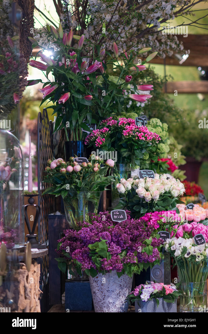Flower shop in Paris, France, selling peonies, roses, lilac, tulips, anemone and hydrangea Stock Photo