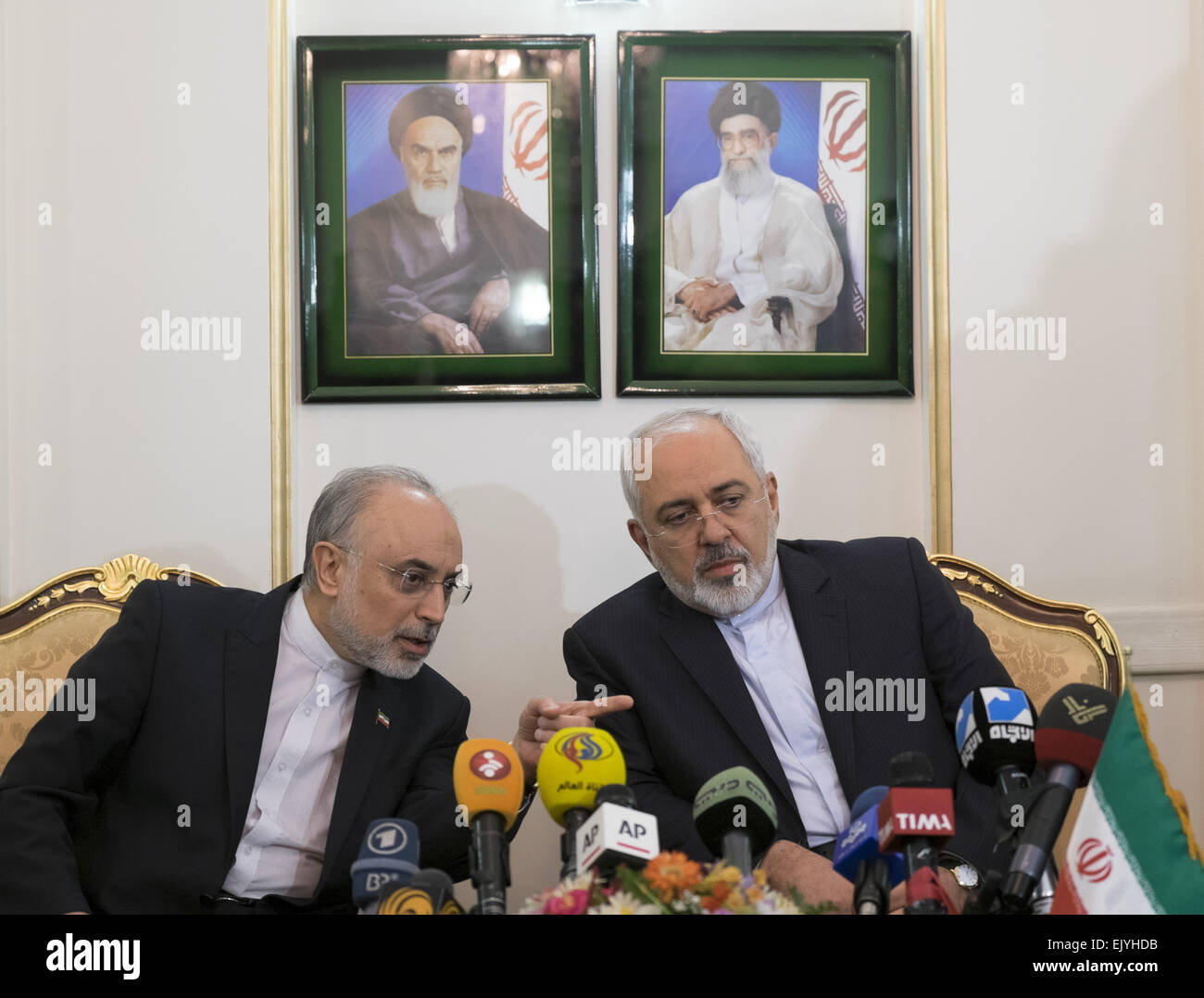 Tehran, Iran. 3rd Apr, 2015. Members of Iran's nuclear negotiation team with world powers in Lausanne, Foreign Minister MOHAMMAD JAVAD ZARIF (R), and The Head of Iran's Atomic Energy Organization, ALI AKBAR SALEHI speak with each other as they attend for speaking with media after arrive Tehran's Mehrabad airport.  Credit:  Morteza Nikoubazl/ZUMA Wire/Alamy Live News Stock Photo