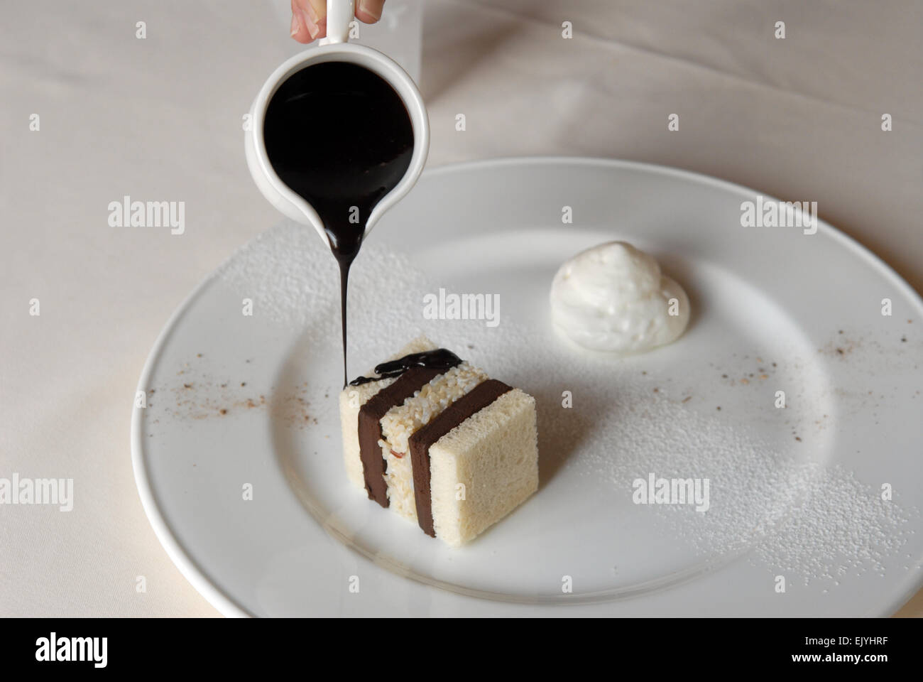Guido restaurant in Pollenzo (Cuneo, Piedmont, Italy), bread and chocolate cake Stock Photo