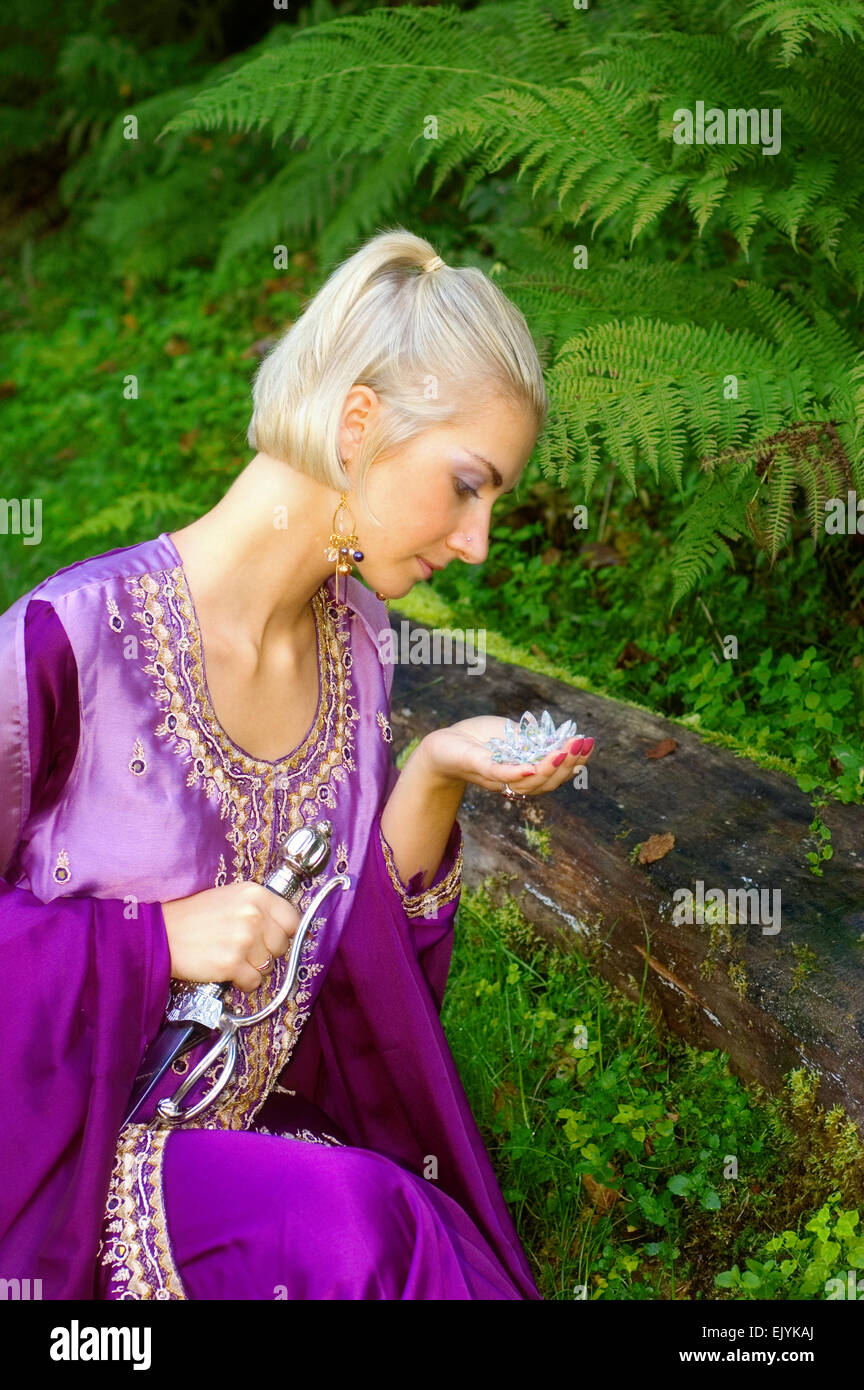 Woman elf with lily Stock Photo