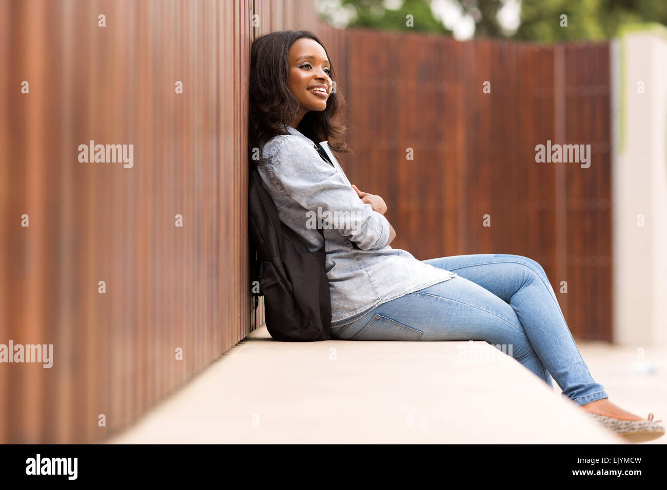 thoughtful young African college girl sitting outdoors Stock Photo - Alamy