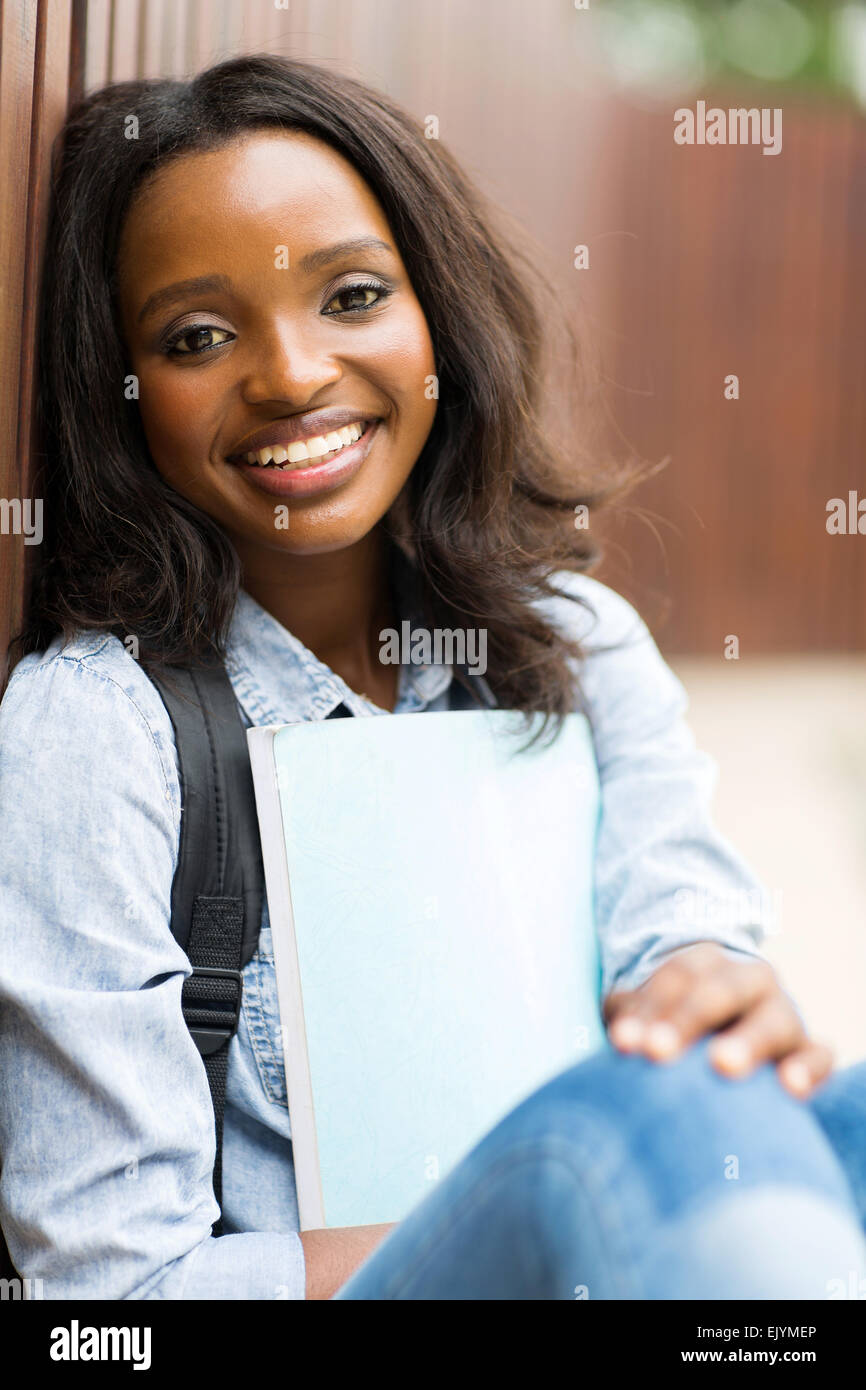 happy female African college student sitting outdoors Stock Photo - Alamy