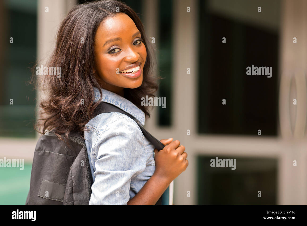 beautiful young African college girl carrying backpack Stock Photo Alamy