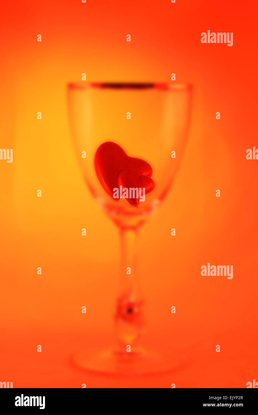 Abstract Blurred Picture Of A Glass Filled With Two Little Hearts Stock 