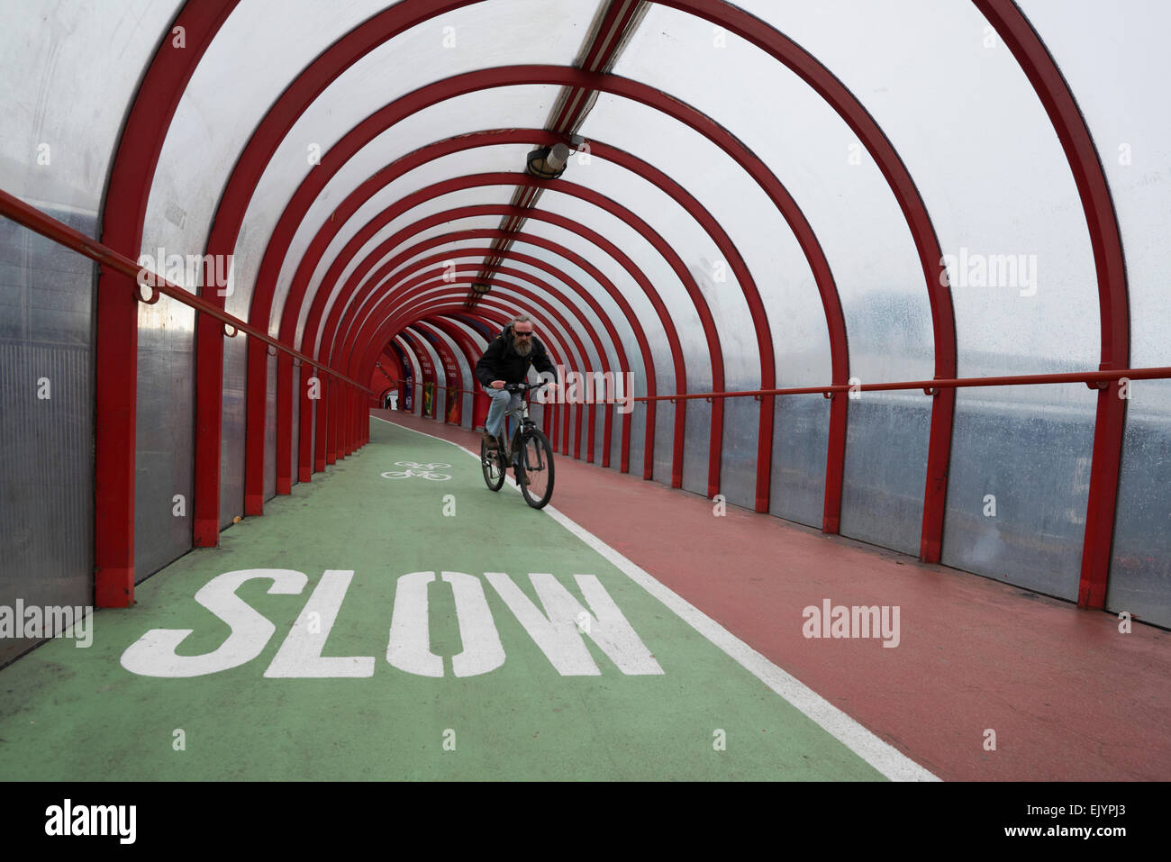Cyclist on the SECC Elevated Walkway and cycle path Glasgow. Stock Photo