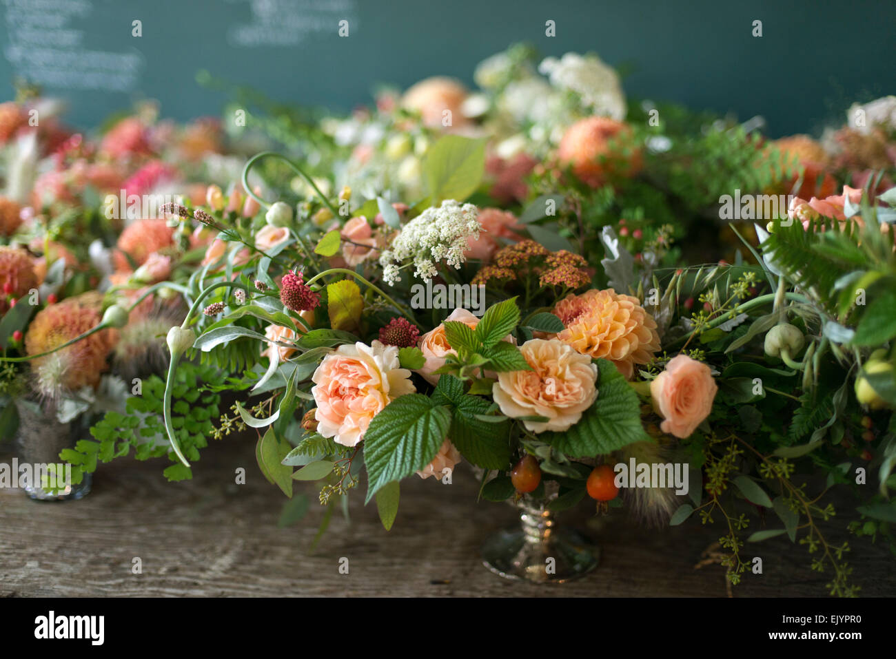Formal floral arrangement of roses in silver urn Stock Photo