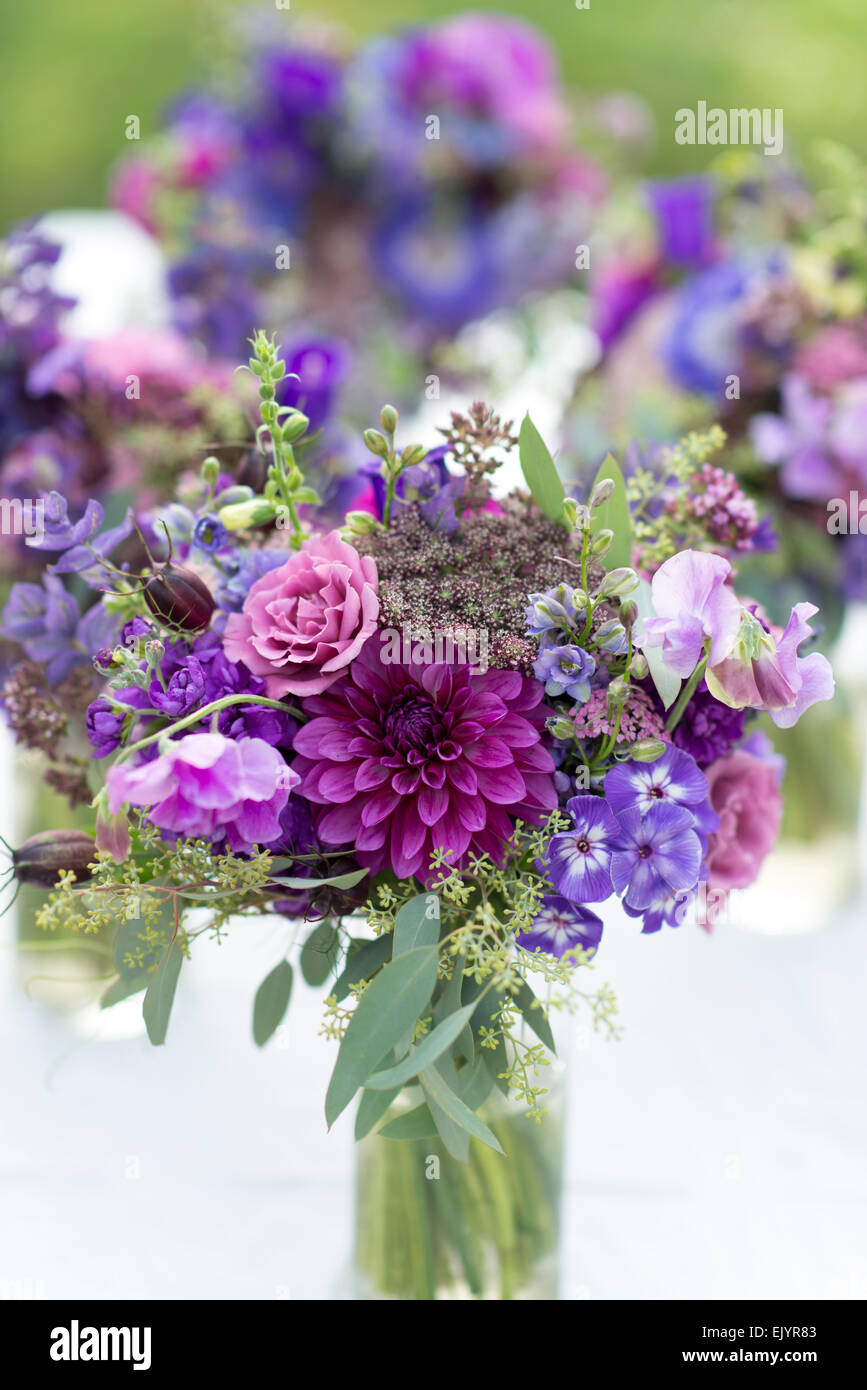 Summer bouquet in blues and purples with roses, dahlia and sweet pea Stock Photo