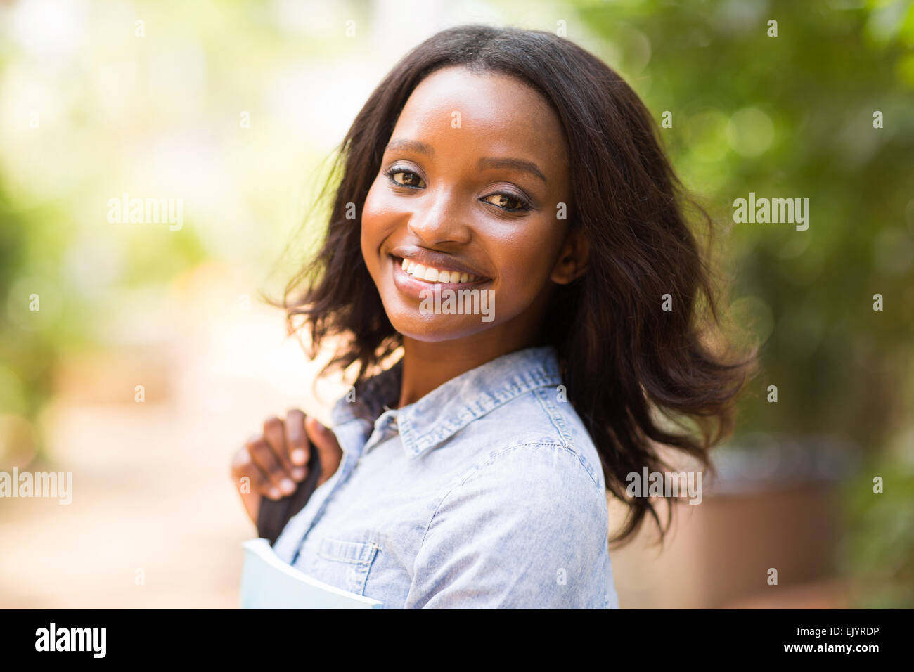 beautiful young African college girl looking at the camera Stock Photo ...
