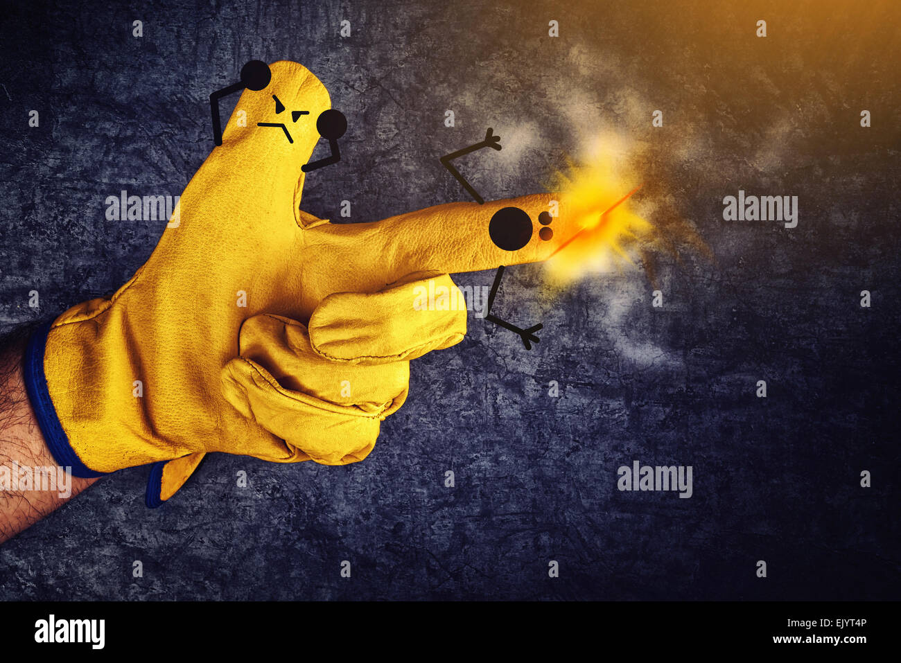 Funny Smileys on Fingers in Protective Yellow Working Gloves, Gun Fire Accident Concept Stock Photo