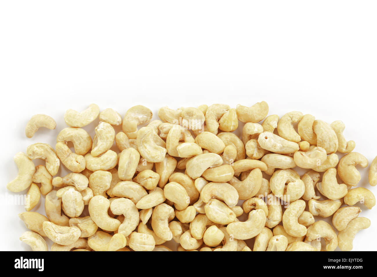 border of dry cashew nuts on white background Stock Photo