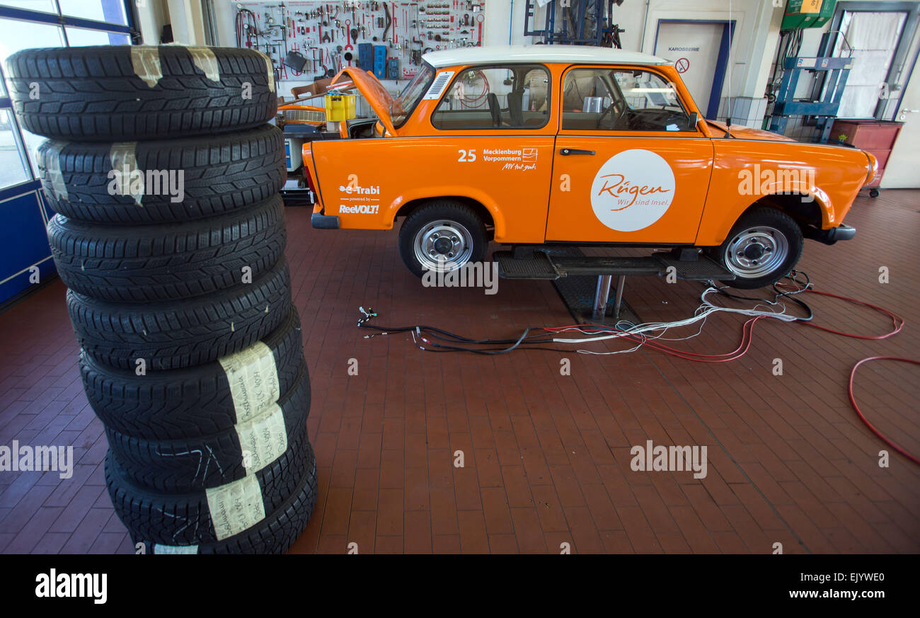 Schwerin, Germany. 12th Mar, 2015. A Trabant (Trabi) car is converted to run on electricity at a workshop in Schwerin, Germany, 12 March 2015. The E-Trabi is intended to be used for tourist safaris on the island of Ruegen in spring 2015. The firm ReeVolt converts existing vehicles to run off electricity. Photo: Jens Buettner/dpa/Alamy Live News Stock Photo