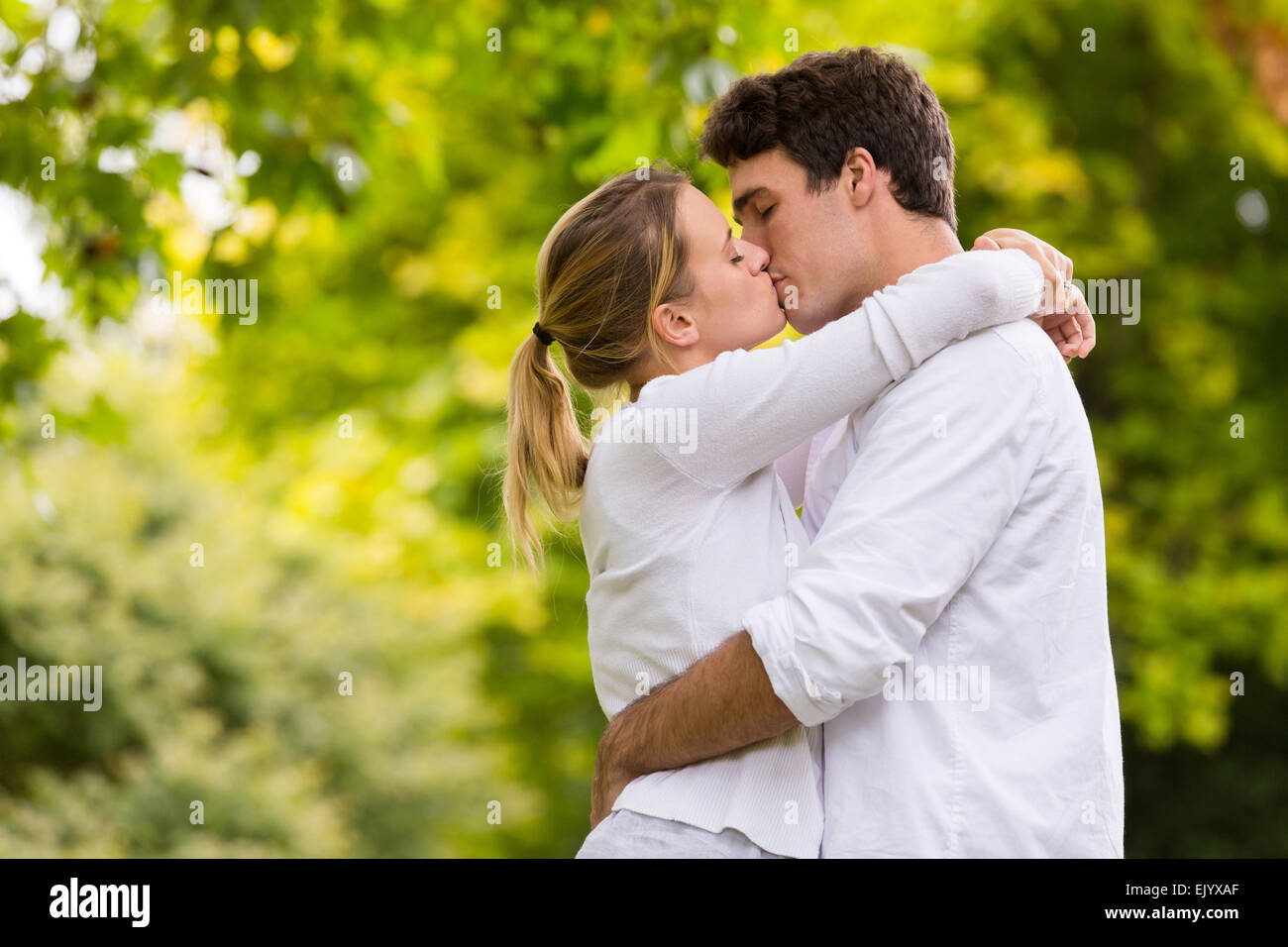 loving young couple kissing outdoors Stock Photo