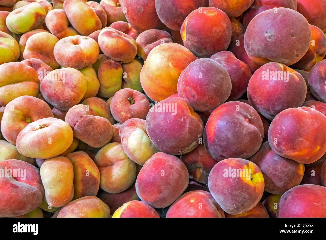 Different kinds of peaches for sale at a market Stock Photo Alamy