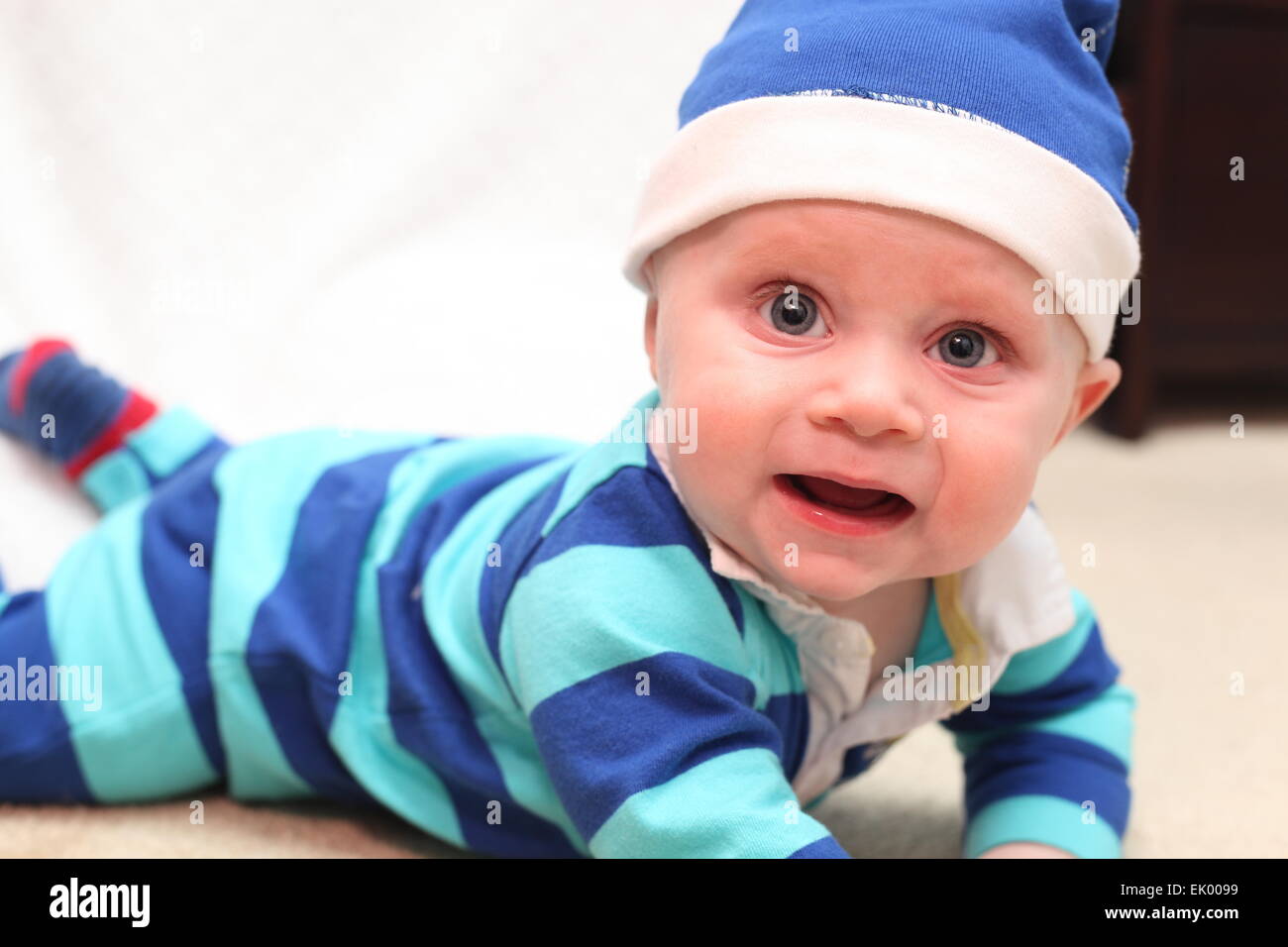 Baby wearing a rugby outfit holding a chalkboard Stock Photo Alamy