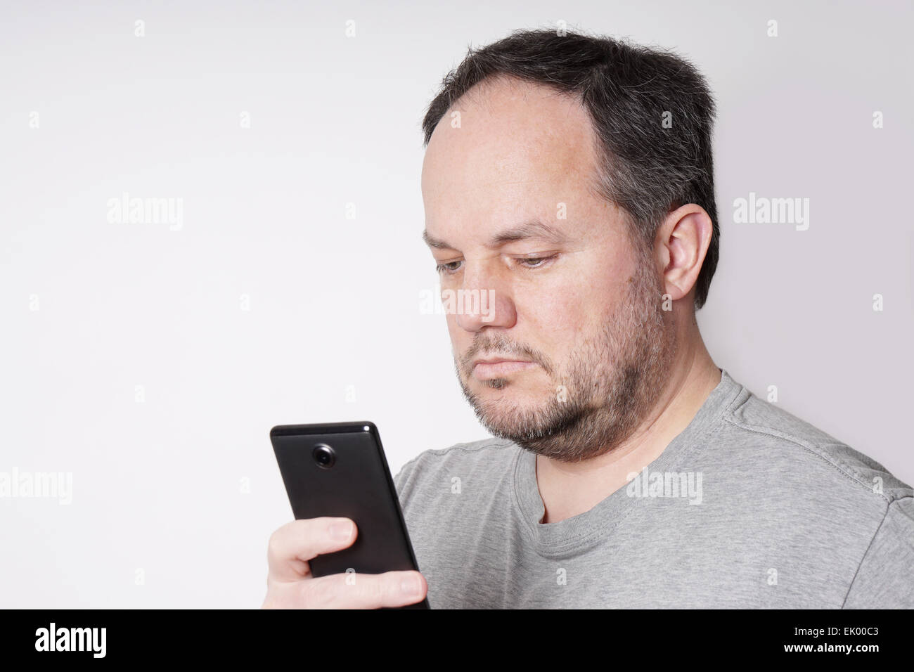 man looking at smart phone Stock Photo