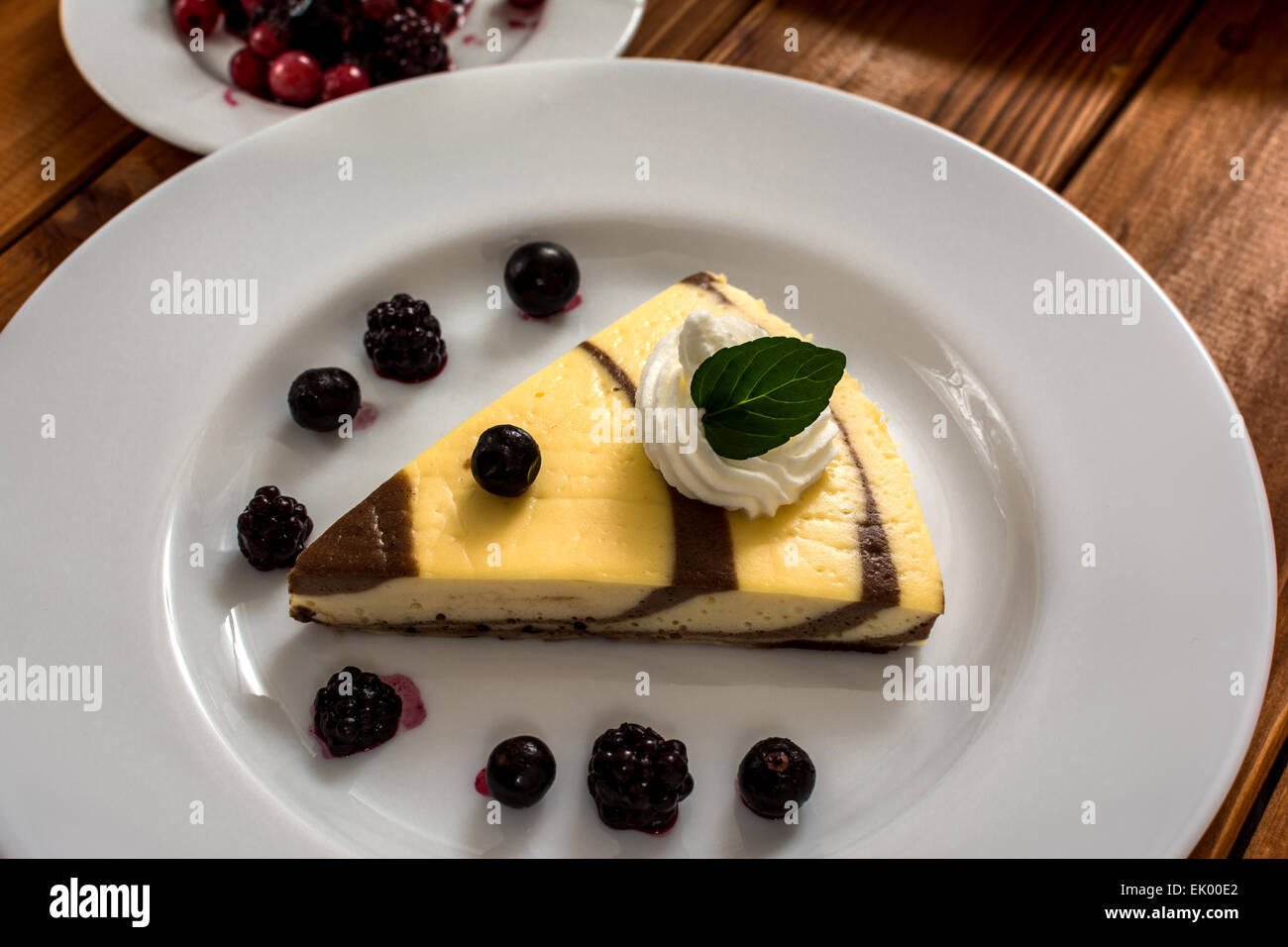 Curd and cocoa dessert with blueberries and blackberry Stock Photo