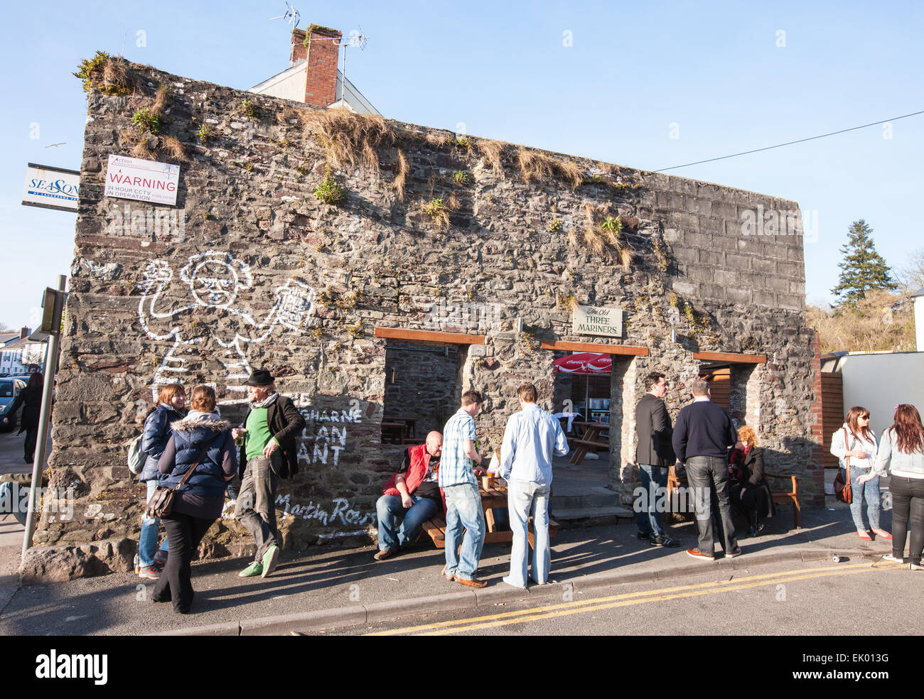 Opposite New Three Mariners pub,Laugharne with drinkers outside,Giant