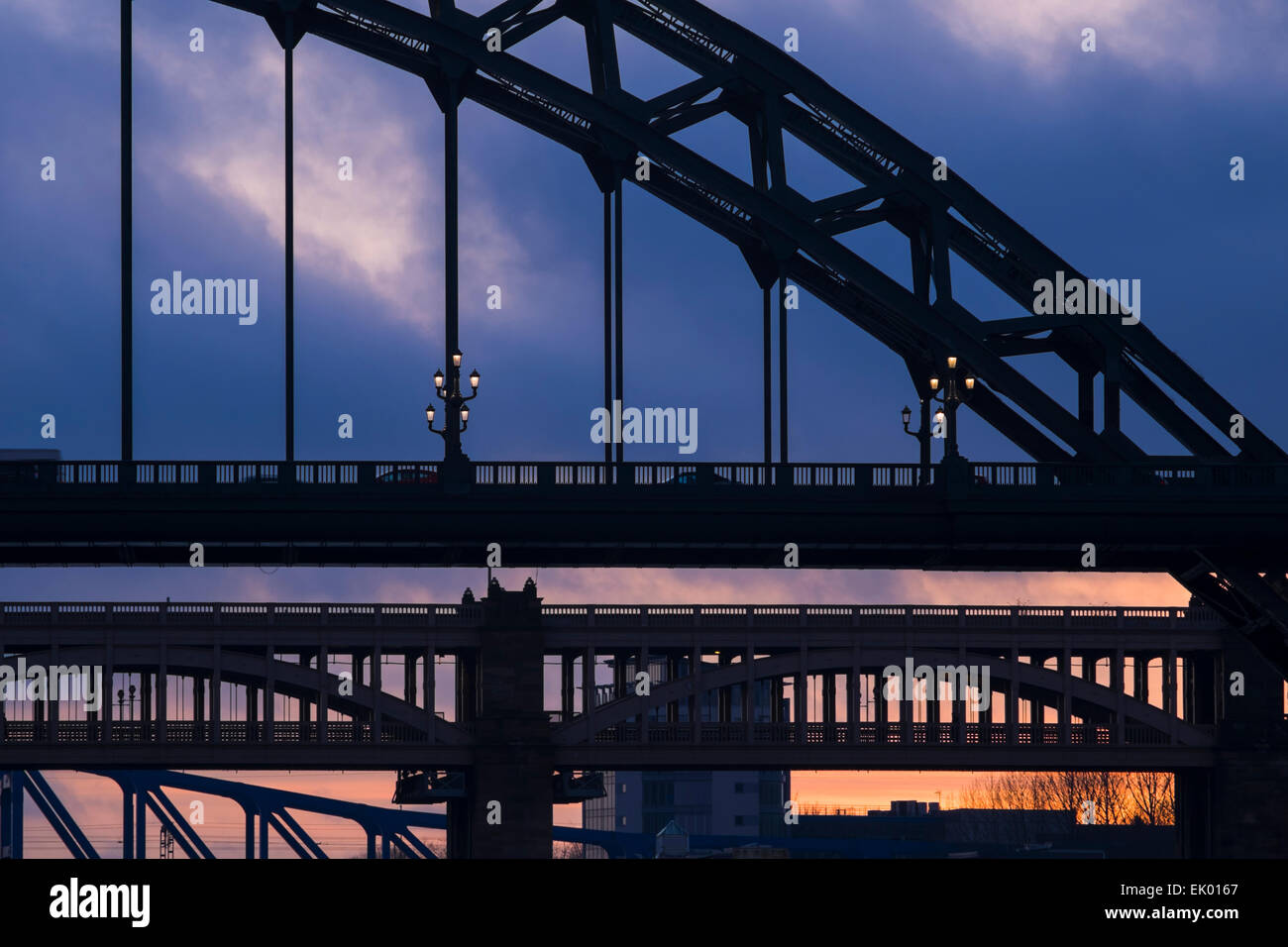 Close-up of the Tyne, High Level and Metro bridges silhouetted against a winter evening sky, Newcastle upon Tyne, England Stock Photo