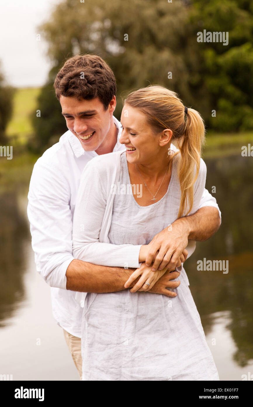 happy couple hugging by the river Stock Photo - Alamy