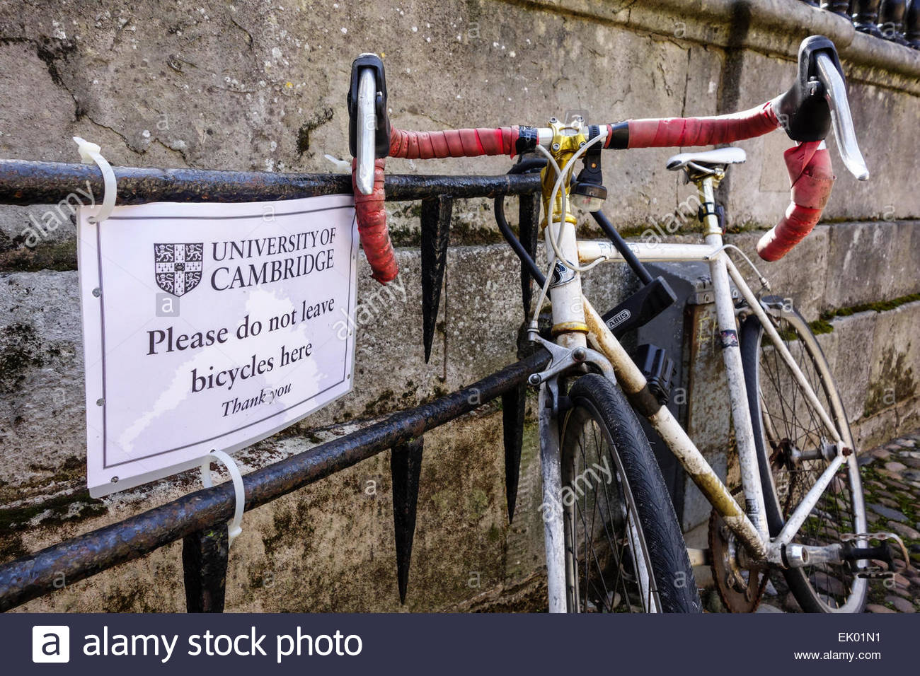 bike sign letter for in Cambridge locked a sign railing next to to Bike a bike sign letter for in Cambridge locked a sign railing next to to Bike a