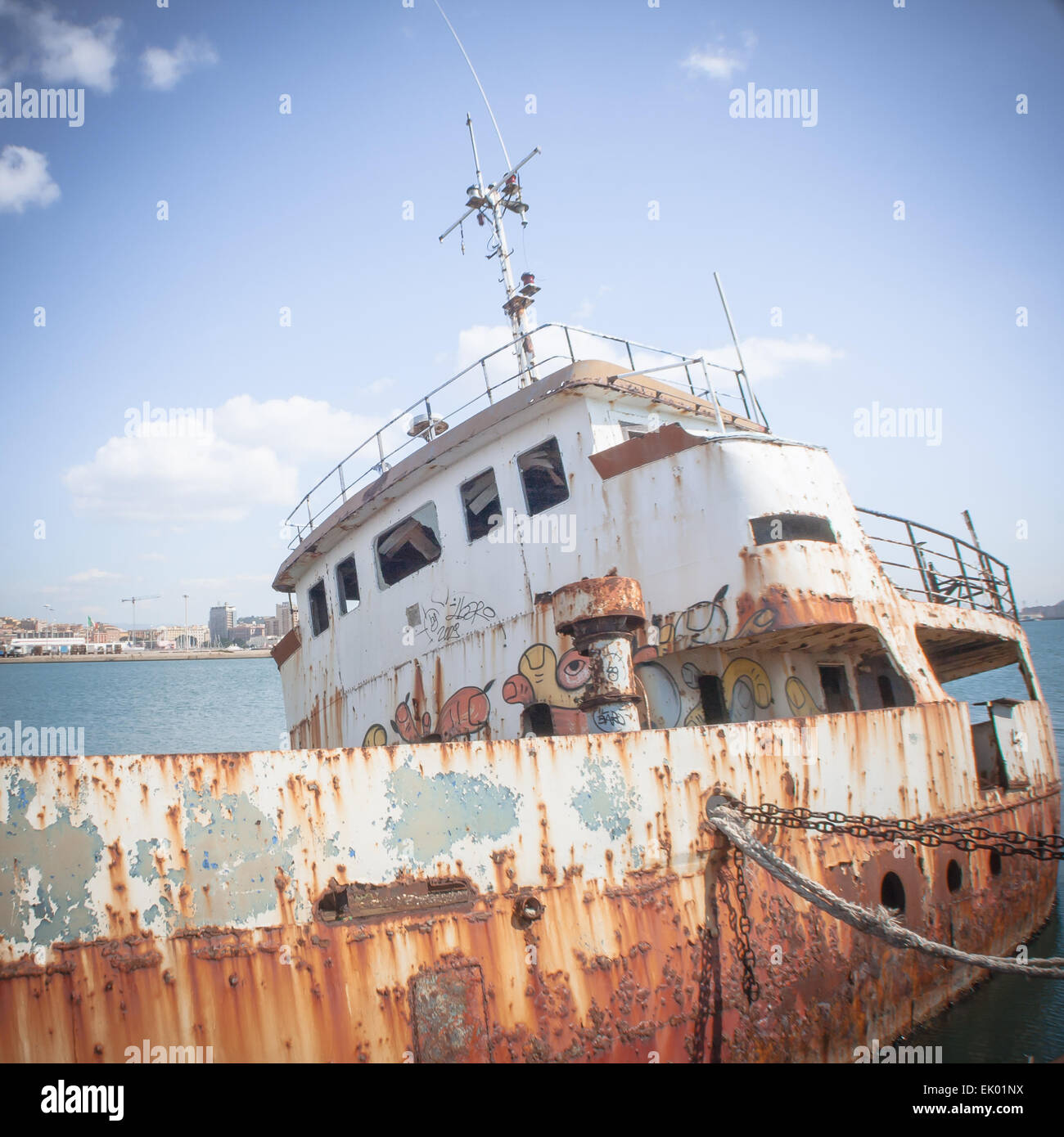 Shipwreck at the pier. harbor of Cagliari - Sardinia. Stock Photo