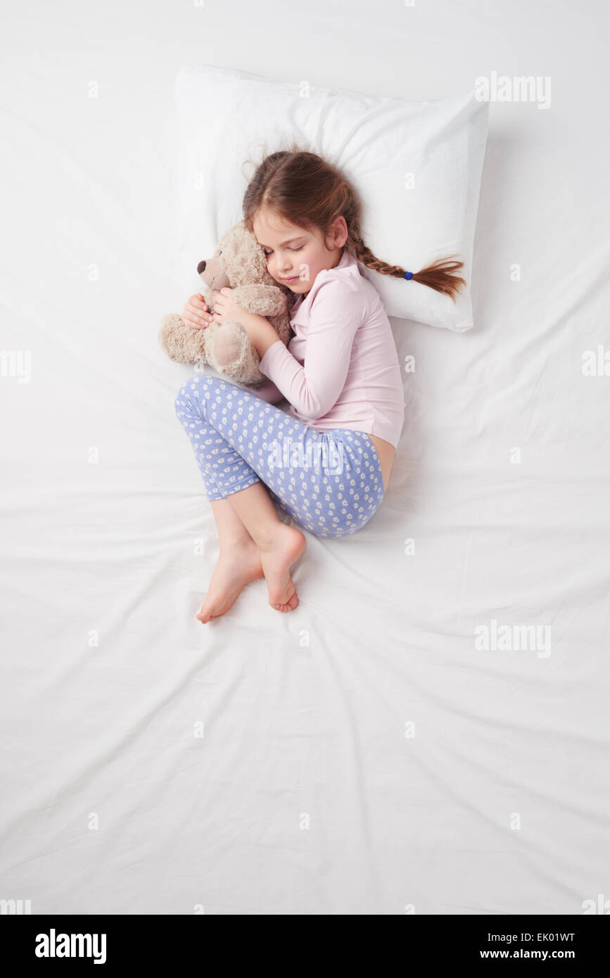 Top view of little cute girl sleeping with teddy bear Stock Photo - Alamy