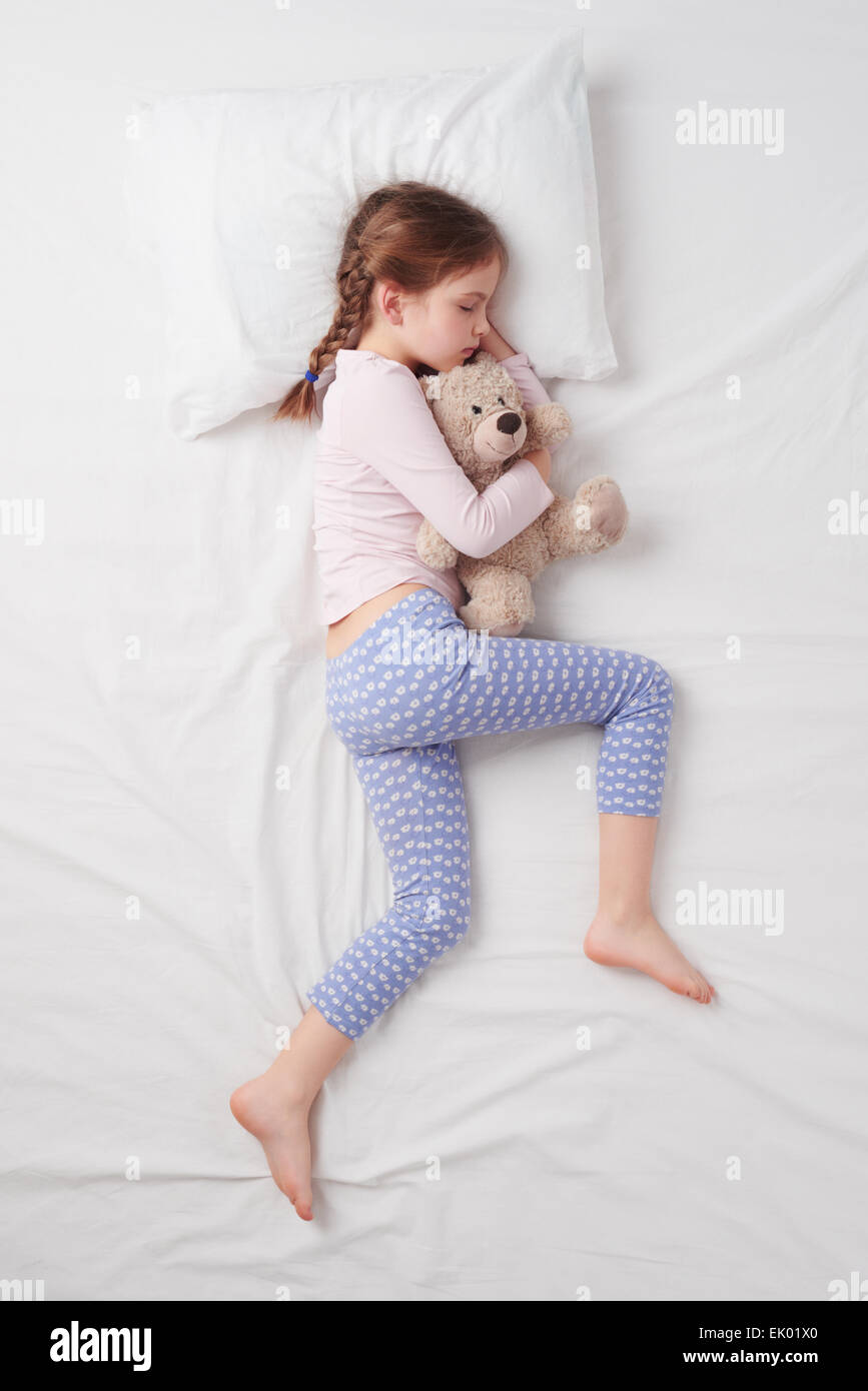 Top view of little cute girl sleeping with teddy bear Stock Photo - Alamy