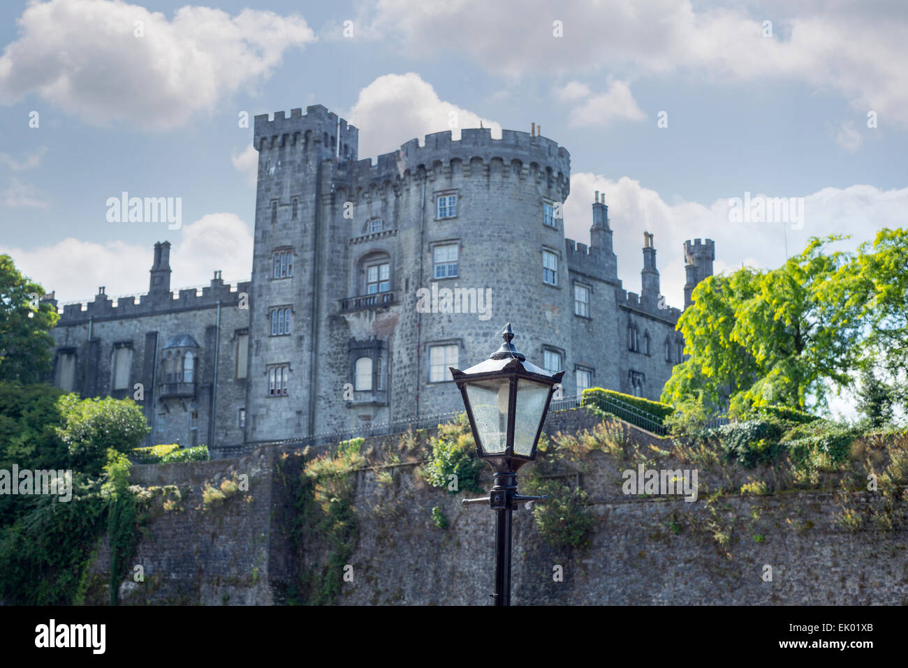 beautiful antique street lamp and riverside view of kilkenny castle in ireland Stock Photo