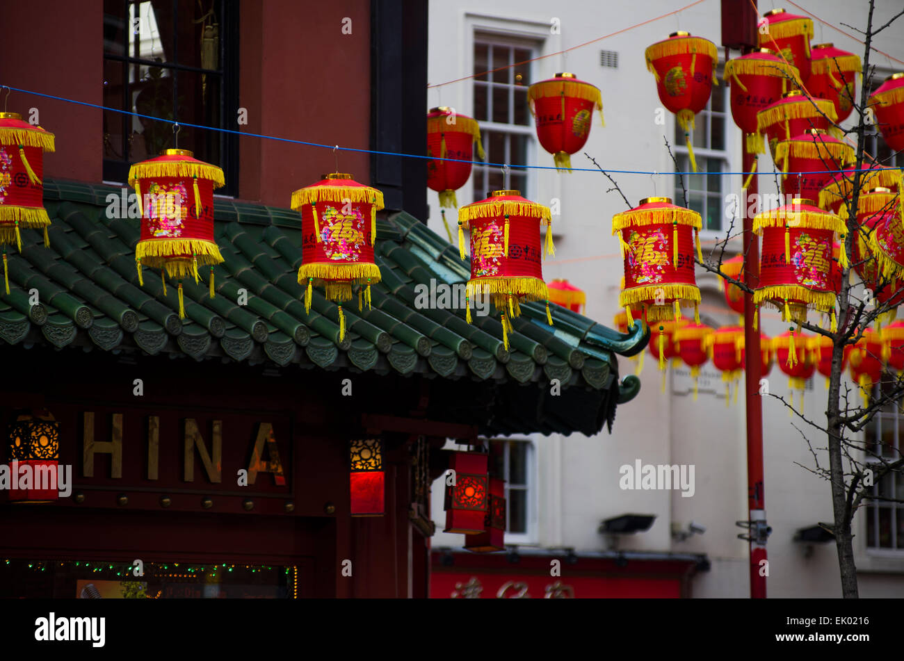 Chinese new year celebration in Chinatown London, England. Colourful lanterns line the streets, crowds of people attending Stock Photo
