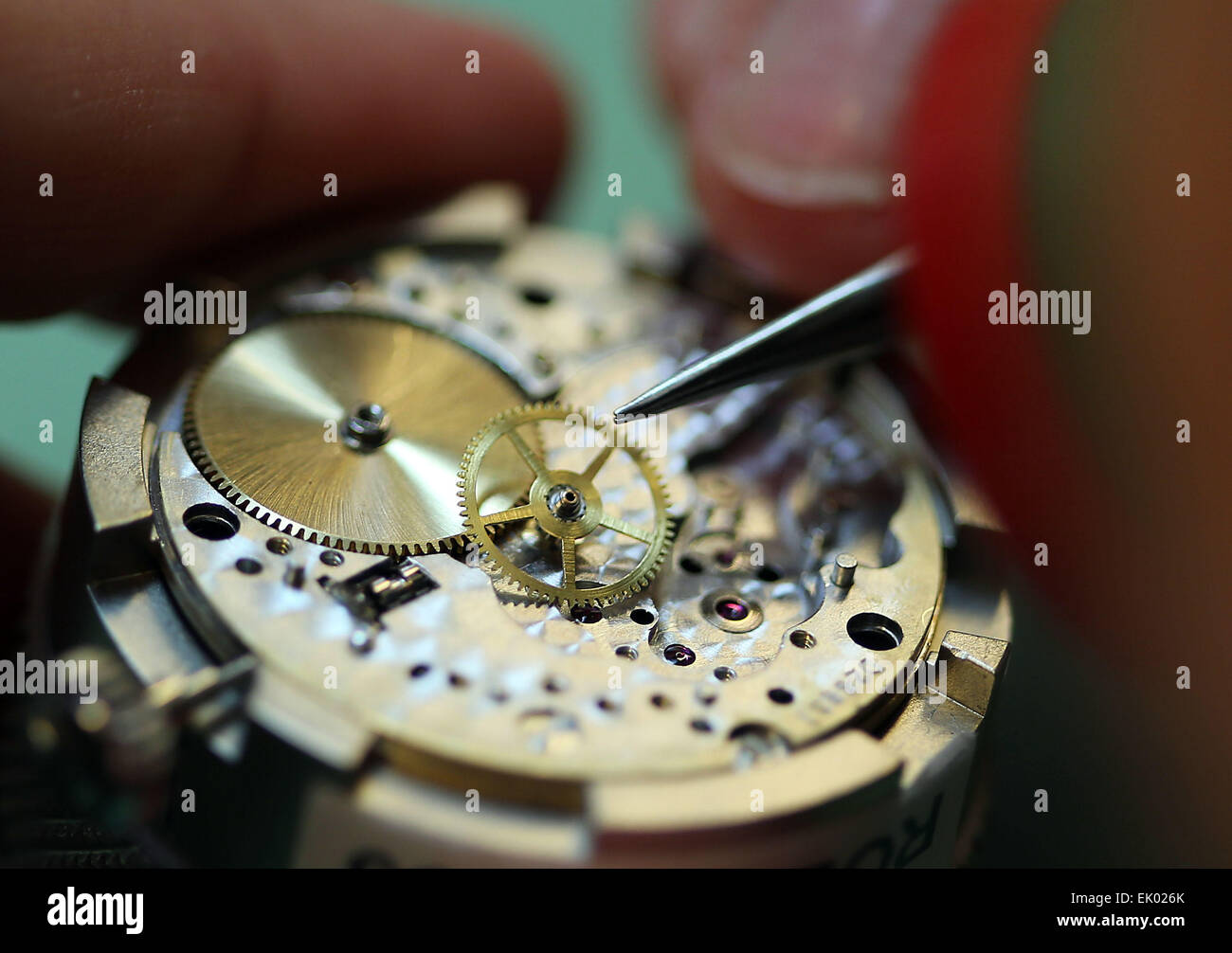 Wuppertal, Germany. 5th Mar, 2015. A watchmaker puts together a timepiece at the Uhrenmuseum (clock museum) in Wuppertal, Germany, 5 March 2015. Photo: Oliver Berg/dpa/Alamy Live News Stock Photo