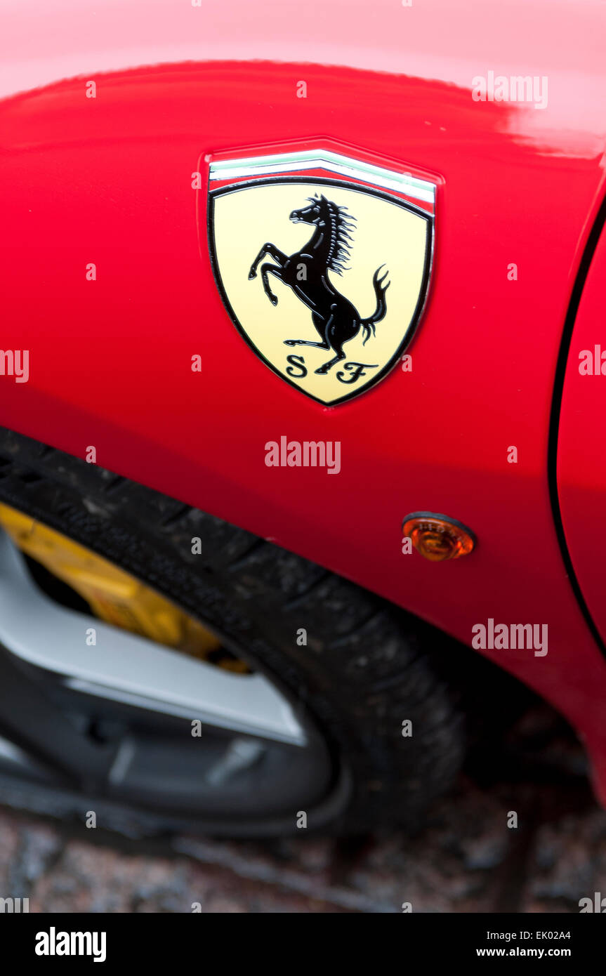 'Prancing Horse' logo on a red Ferrari car Stock Photo