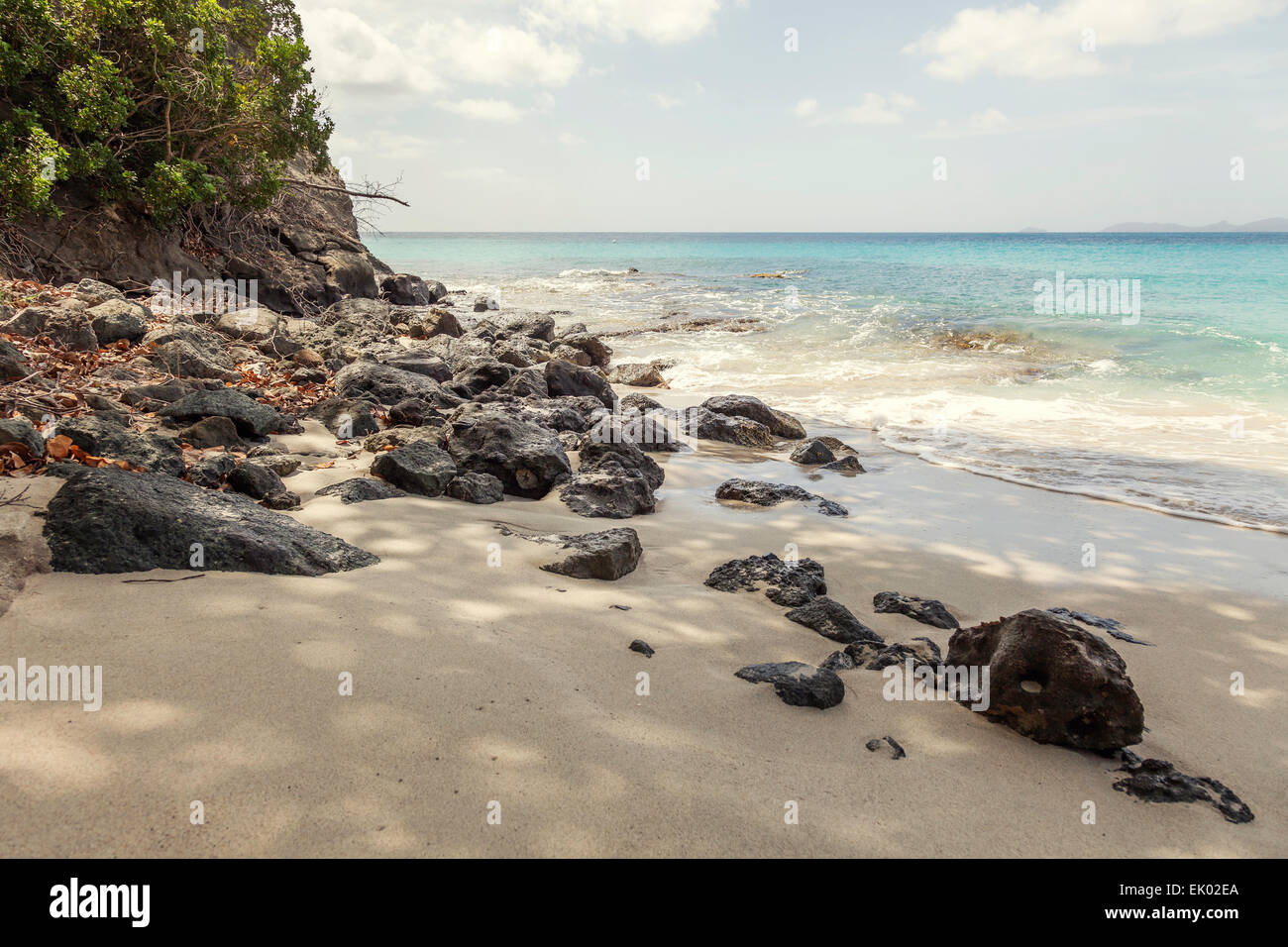 Rocky beach on tropical island of Mustique. Stock Photo