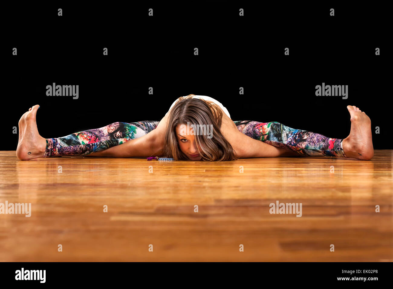 Female Yoga Model Kurmasana Tortoise Pose Stock Photo