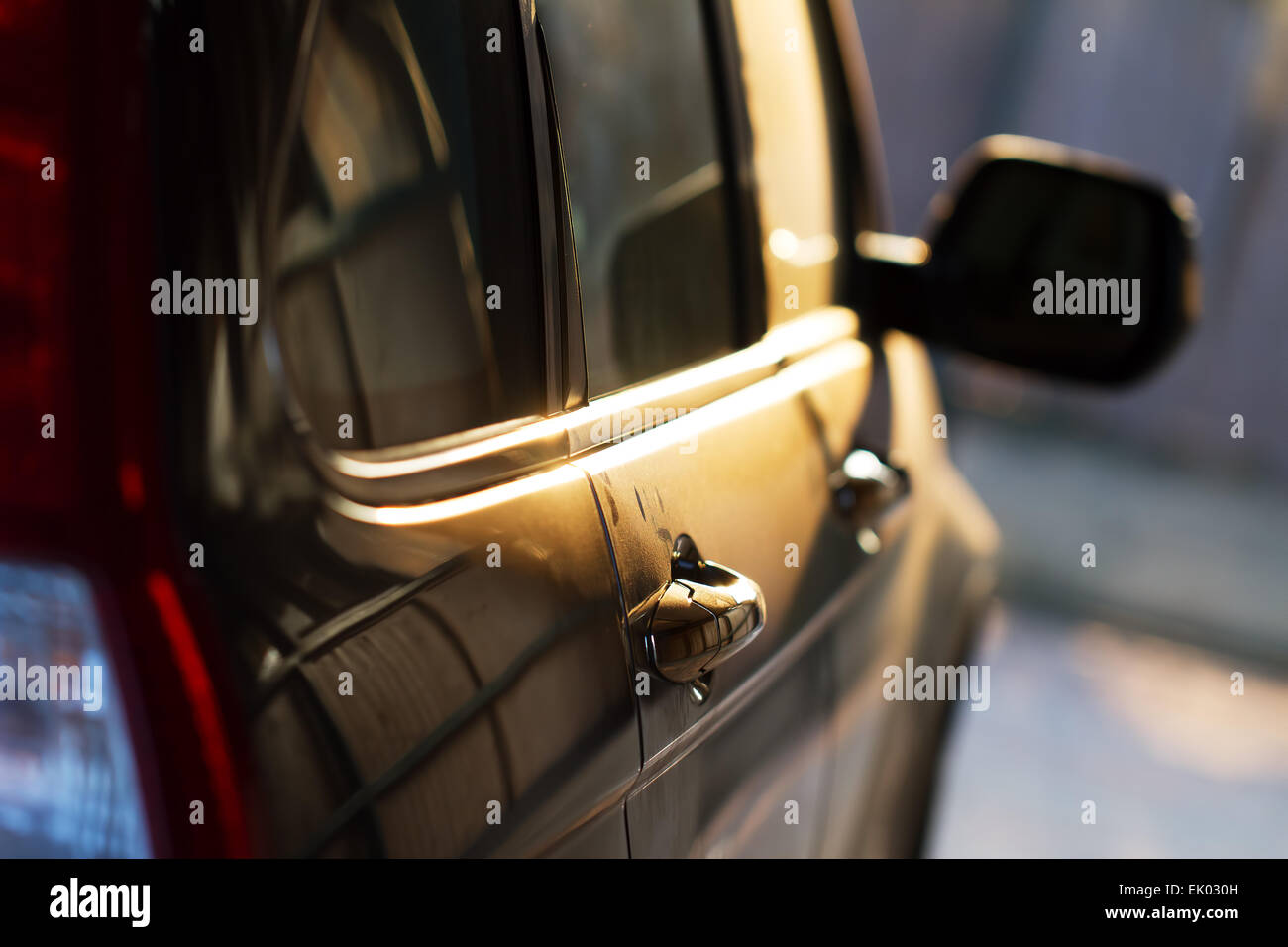 Side of a SUV Car in the Sunset Stock Photo