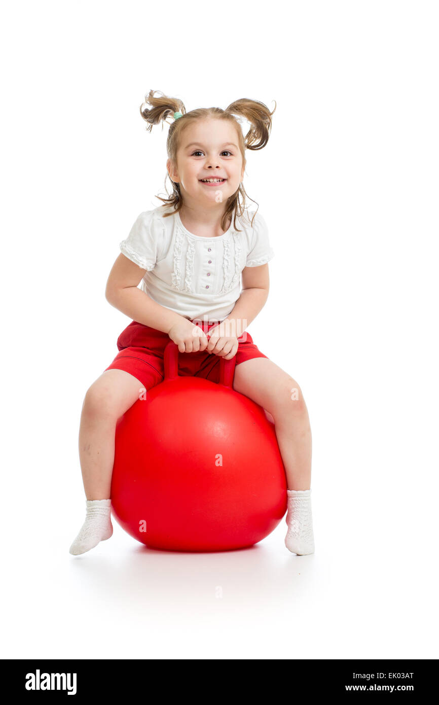 happy child jumping on bouncing ball Stock Photo