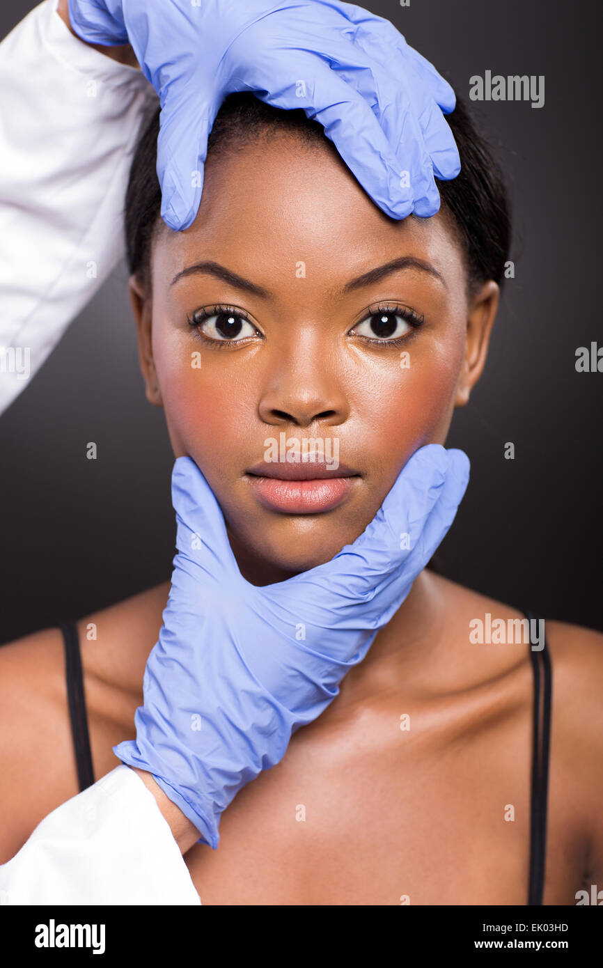 cosmetic doctor skin check after plastic surgery Stock Photo